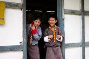 two children in the school gate in Meritsemo, Bhutan
